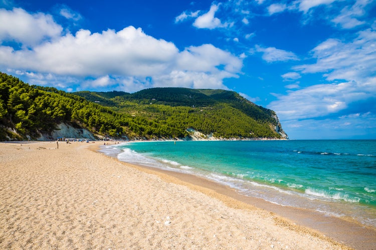 Photo of the famous Urbani beach and blue sky of Sirolo, Monte Conero, Marche, Italy.