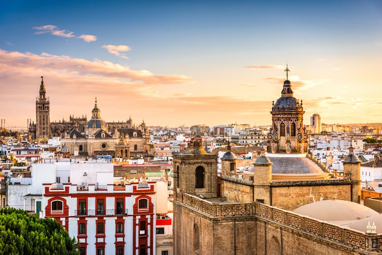 Scenic view of Seville-s skyline at sunset, featuring the Cathedral, Giralda tower, and historic architecture..jpg