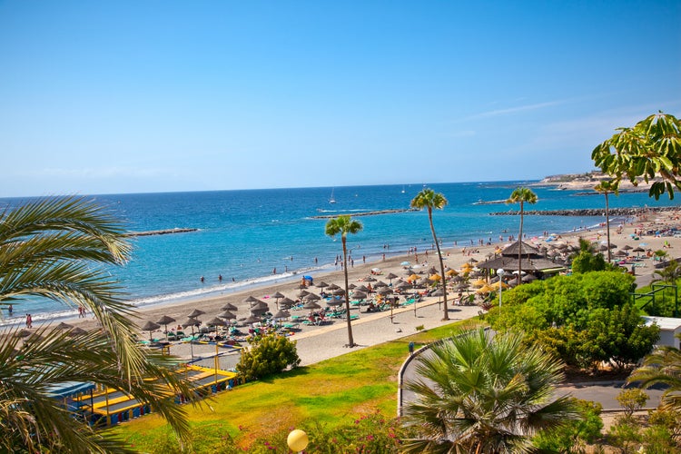 Photo of beautiful sandy beach in Adeje Playa de las Americas on Tenerife, Spain.