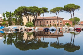 Photo of Cervia's canal, where the Salt Museum is located, with reflections on the water ,Italy.