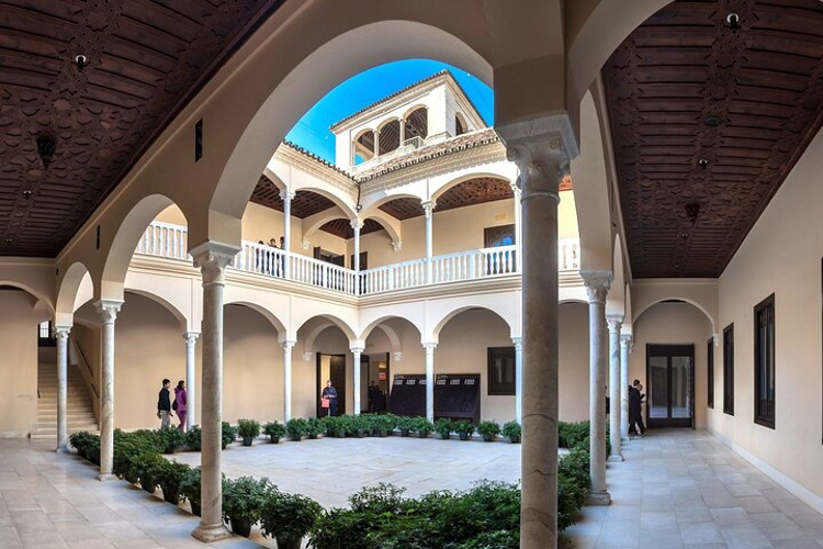 A serene courtyard at the Picasso Museum showcases the rich history of Spain-s urban landscape..png