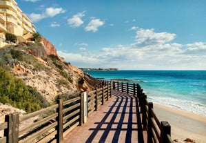 photo of aerial panoramic drone point of view Cabo Roig coastline with blue Mediterranean Seascape view, residential buildings near sandy beach at sunny summer day. Province of Alicante, Costa Blanca. Spain.