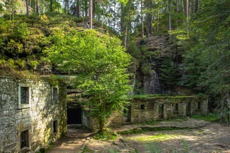 Photo of beautiful abandoned Dolsky Mill in the valley of the Kamenice river, Czech Republic.