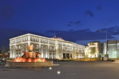 Photo of beautiful view of Museum of the Macedonian Struggle building at night in Skopje, Macedonia.