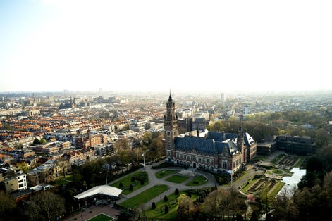 photo of The Peace Palace in The Hague in an aerial shot. The garden of the International Court of Justice can be seen around the Vredespaleis in the Netherlands.