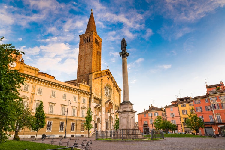 Photo of Piazza Duomo in the city center with the cathedral of Santa Maria Assunta and Santa Giustina, warm light at sunset, Piacenza, medieval town, Italy.