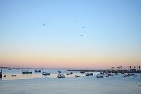Photo of aerial view over People Crowd Having Fun On Beach And Over Cascais City In Portugal.