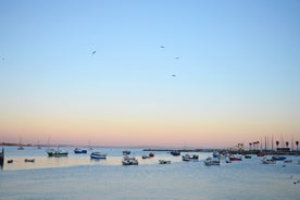 Photo of aerial view over People Crowd Having Fun On Beach And Over Cascais City In Portugal.