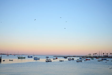 Photo of Sunset colours and fishing boats in Cascais, Portugal.
