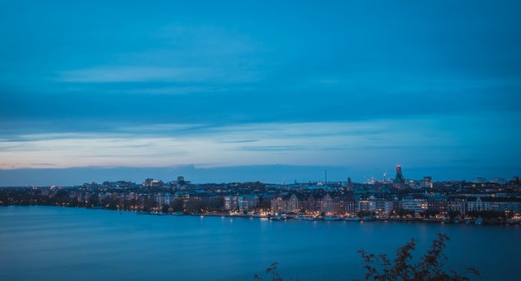 photo of beautiful landscape photo of Stockholm cityscape viewed from Skinnarviksberget on early evening in autumn in Sweden.