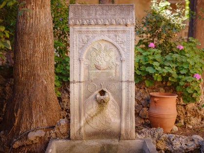 photo of Rhodes, Greece - April 21, 2023: Archeological Museum of Rhodes Town. details of antic statues and other exhibits of museum, museum backyard garden Sultans part of building, era of Ottoman