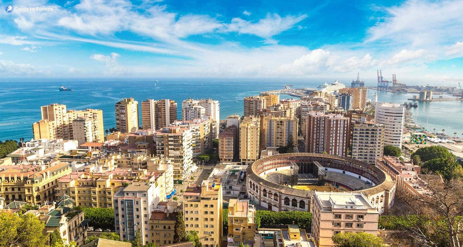 A panoramic view of Malaga, Spain, showcasing its vibrant architecture and coastal scenery under a clear blue sky..png