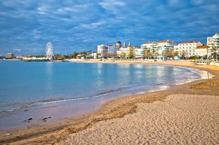 Photo of aerial cityscape view on French riviera with yachts in Cannes city, France.