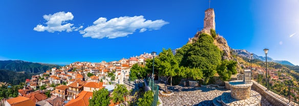 photo of green slopes surrounding the mountain town of Arachova near Parnassus Mountains, Greece.