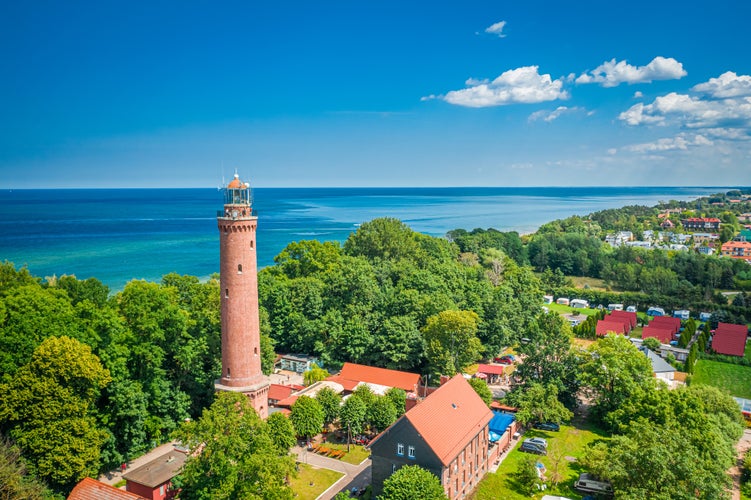 Lighthouse and blue sky by Baltic Sea, aerial view of Poland