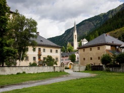 Photo of  beautiful Scuol town in Swiss Alps and Inn river, Switzerland.