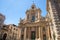 photo of view Basilica della Collegiata Baroque church Santa Maria dell' Elemosina Royal Chapel (Regia Cappella) on Via Etna street in city centre of Catania, Sicily, Italy.