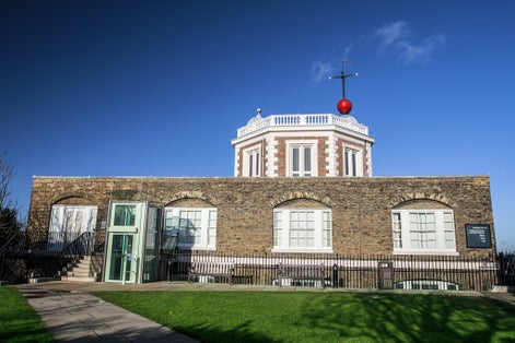 Photo of Red Timeball on top of Octagon Room Royal Greenwich Observatory, London, UK.
