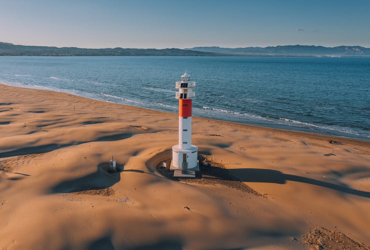 Aerial view of Lighthouse "el Far del Fangar" on Delta de l'ebre natural park, tarragona, Catalonia, Spain.