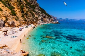 Photo of aerial view of Pittulongu, White Beach in Olbia, blue water, amazing Vegetation and sandy beaches with Tavolara island view, Italy.