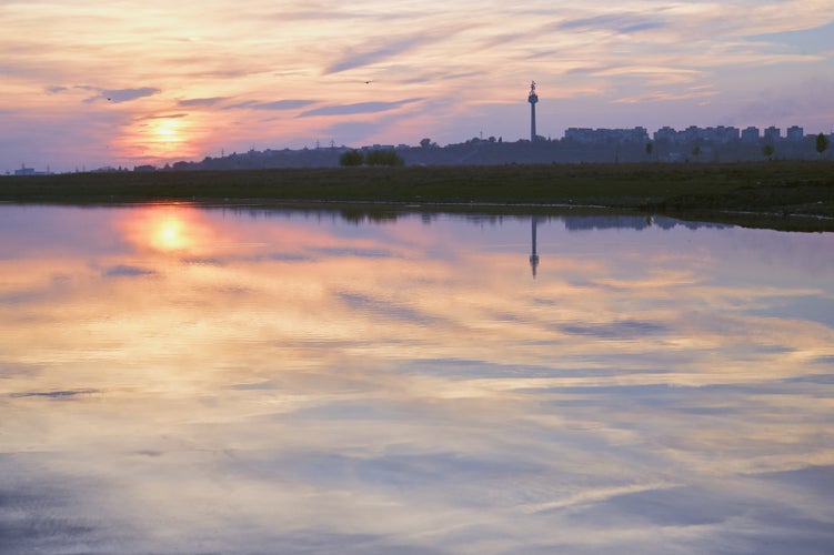 Photo of sunset reflection on Danube river in Galati, Romania.