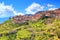 photo of green slopes surrounding the mountain town of Arachova near Parnassus Mountains, Greece.