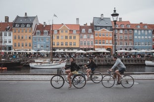 Scenic summer view of Nyhavn pier with color buildings, ships, yachts and other boats in the Old Town of Copenhagen, Denmark