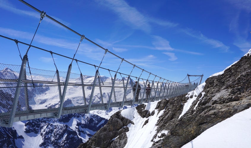 Suspension bridge on Mt. Titlis in wintertime. The Titlis is a mountain located on the border between the Swiss cantons of Obwalden and Bern, mainly accessed from the town of Engelberg.