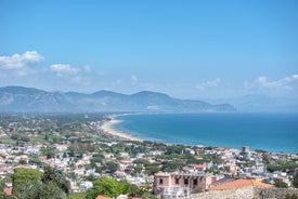 Photo of Umbrellas and sunbeds in San Felice Circeo, Italy.