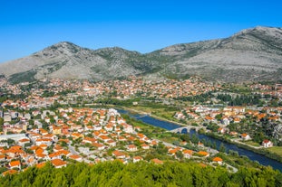 Photo of aerial view of the old bridge and river in city of Mostar, Bosnia and Herzegovina.