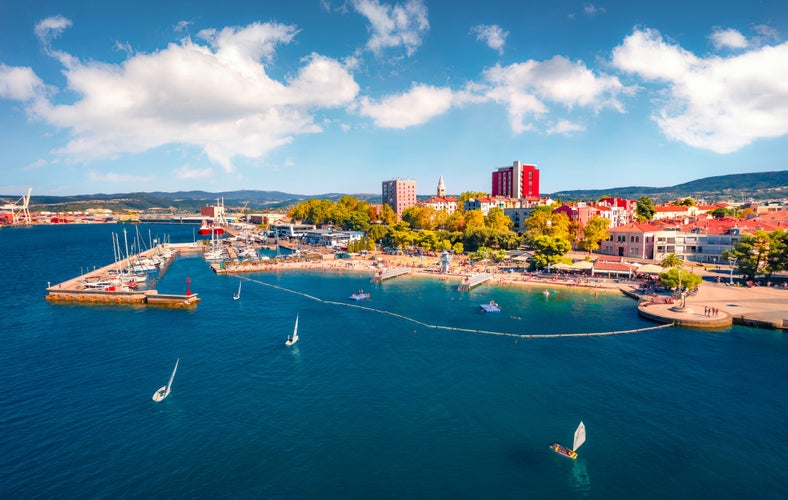 Small yachts on Koper port. Aerial outdoor scene of Adriatic coastline, Slovenia, Europe. Beautiful Mediterranean seascape. Vacation concept background.