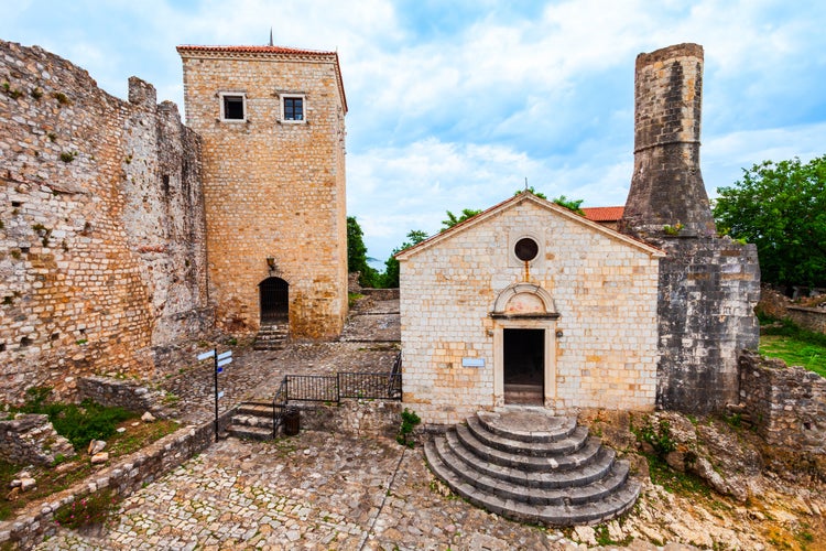 photo of street view of the Archaeological Museum or Local History Museum in Ulcinj Old Town or Stari Grad in Ulcinj, Montenegro. The museum is located in the old church, which was built in 1510.