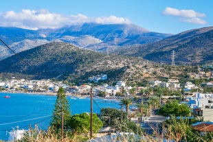 Photo of aerial view of Malia beach and small island with Church of Transfiguration, Heraklion, Crete, Greece.