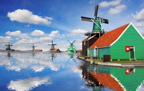 Amsterdam Netherlands dancing houses over river Amstel landmark in old european city spring landscape.