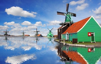 Amsterdam Netherlands dancing houses over river Amstel landmark in old european city spring landscape.