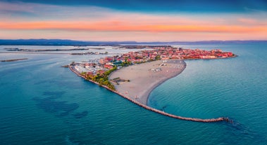 Photo of Trieste lighthouse Phare de la Victoire and cityscape panoramic aerial view, Friuli Venezia Giulia region of Italy.