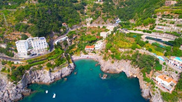 Photo of aerial morning view of Amalfi cityscape on coast line of Mediterranean sea, Italy.