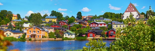 Early autumn morning panorama of the Port of Turku, Finland, with Turku Castle at background.