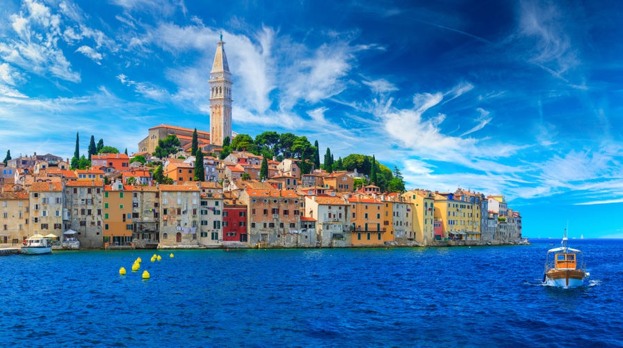 photo of view of Wonderful romantic old town at Adriatic sea. Boats and yachts in harbor at magical summer. Rovinj. Istria. Croatia. Europe.