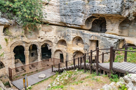 photo of Hayat Samandag Vespasianus Titus Tunnel breathtaking picturesque view of Necropolis on a blue sky day in Summer in Antakya, Turkey.