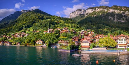 Photo of beautiful autumn view of Lauterbrunnen valley with gorgeous Staubbach waterfall and Swiss Alps at sunset time, Switzerland.