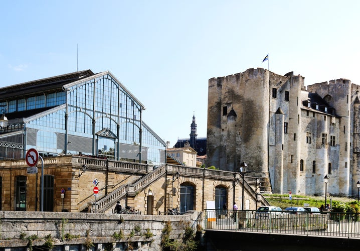 photo of view of Niort is town in western France. View of the Donjon and the building of the market, Niort, France.