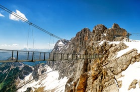 Photo of Suspension Bridge of Dachstein Skywalk viewpoint in Austria, with people, in Ramsau am Dachstein.