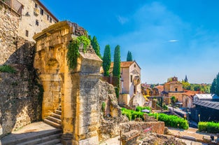 Photo of beautiful view of canal with statues on square Prato della Valle and Basilica Santa Giustina in Padova (Padua), Veneto, Italy.