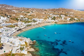 Photo of panoramic aerial view of the popular Platis Gialos beach on the Greek island of Mykonos with turquoise sea, Greece.