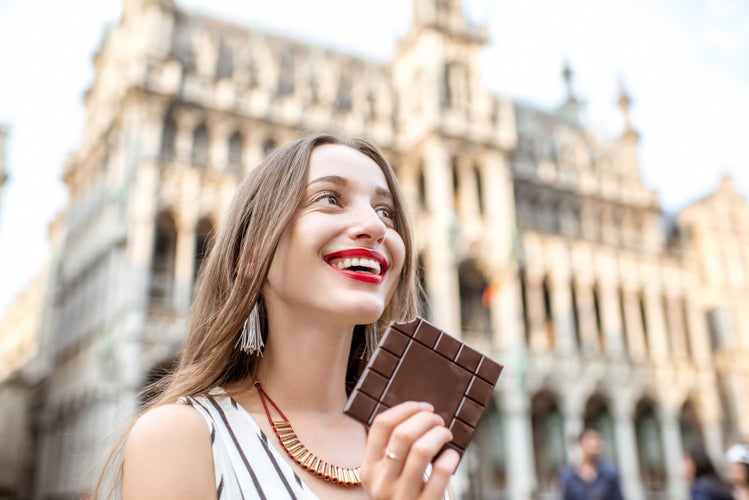 woman with chocolate outdoors in brussels .jpg