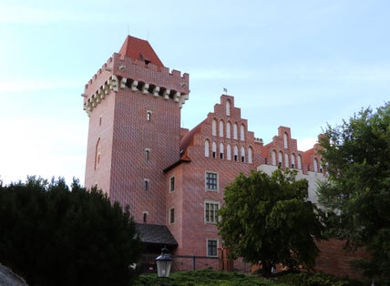 Poznań Royal Castle on blue sky.