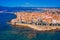 Photo of aerial view of Alghero on a beautiful day with harbor and open sea, Italy.