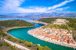 Photo of aerial view of town of Umag historic coastline architecture , archipelago of Istria region, Croatia.