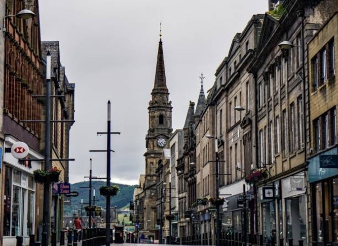 The main street in Inverness, Scotland, lined with historic buildings and shops.jpg